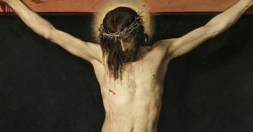 A painting of Christ crucified is seen above.