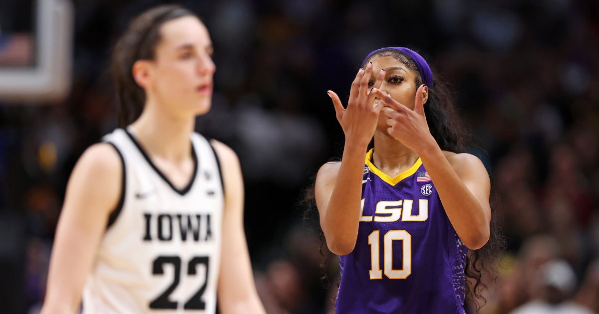 Angel Reese of LSU, right, taunts Iowa star Caitlin Clark in the fourth quarter of the NCAA Women's Basketball Tournament championship game at American Airlines Center in Dallas on Sunday.
