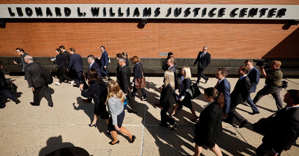 Lawyers representing Dominion Voting Systems leave the Leonard Williams Justice Center following a settlement with Fox News on Tuesday in Wilmington, Delaware.
