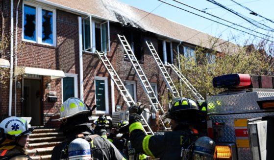 A 7-year-old boy and a 19-year-old girl were killed in the fire, which officials said blocked the front door.