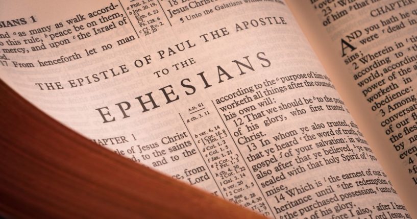 A Bible lays open to the book of Ephesians in the above stock image.