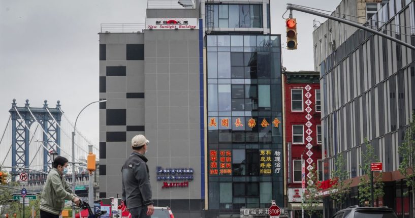 A six story glass facade building, center, is believed to be the site of a foreign police outpost for China in New York City's Chinatown.