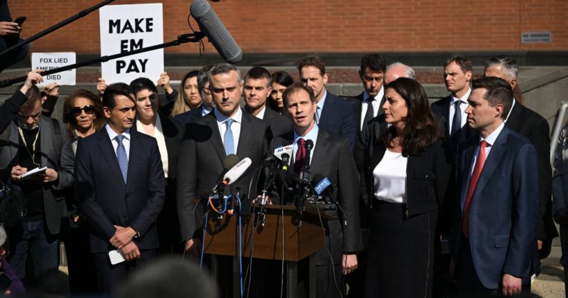 Justin Nelson, joined by fellow members of the Dominion Voting Systems legal team, speaks to members of the media outside the Leonard Williams Justice Center in Wilmington, Delaware, on Tuesday.