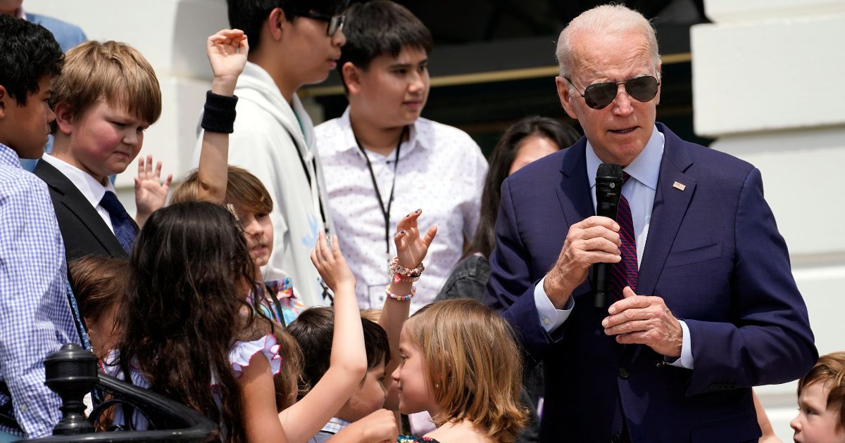 President Joe Biden speaks to children during a Take Your Child to Work Day event at the White House in Washington on Thursday.