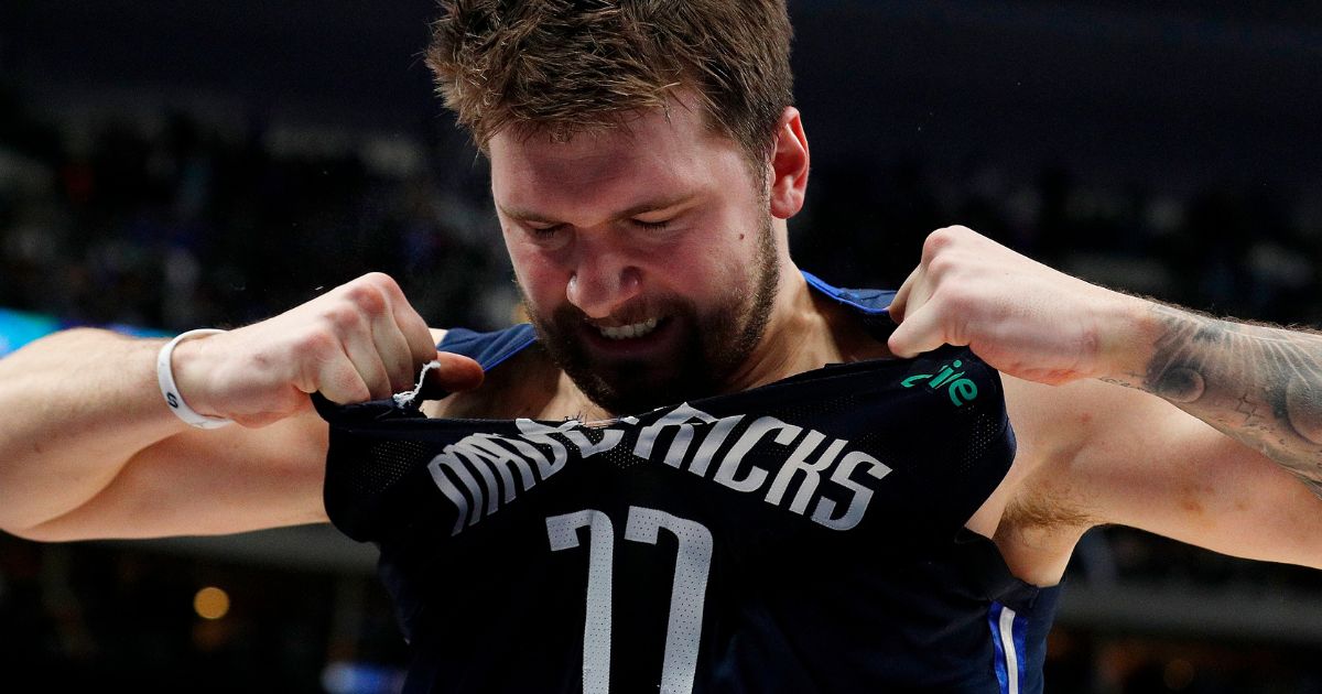 Luka Doncic of the Dallas Mavericks rips his jersey as he walks off the court after a loss to the Los Angeles Clippers at American Airlines Center on Feb. 12, 2022 in Dallas, Texas.