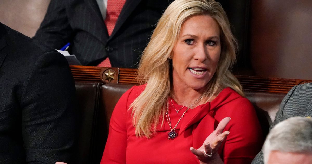 Rep. Marjorie Taylor Greene talks at the Capitol on March 1, 2022, in Washington, D.C.