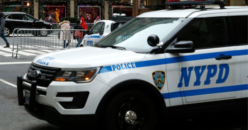 An NYPD car is seen near the Saks Fifth Avenue department store in Midtown in New York City on Dec. 4, 2020.