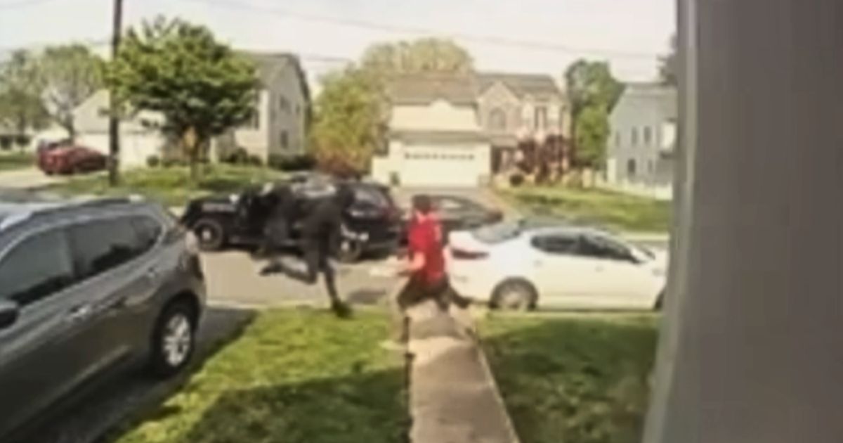 Pizza delivery man Tyler Morell moves to trip a fleeing suspect in front of a home near Philadelphia.