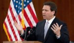 Florida Gov. Ron DeSantis answers questions from the media on March 7 in Tallahassee, Florida.