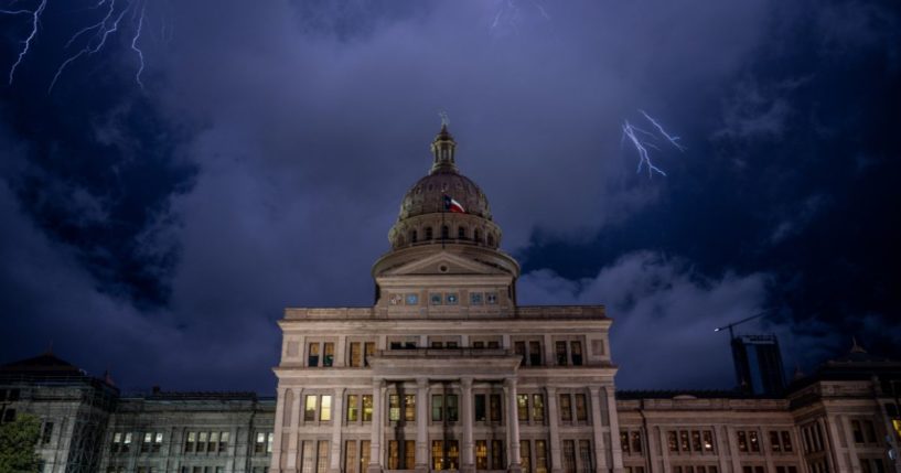 The Texas State Capitol is seen in a thunderstorm on Friday in Austin, Texas.