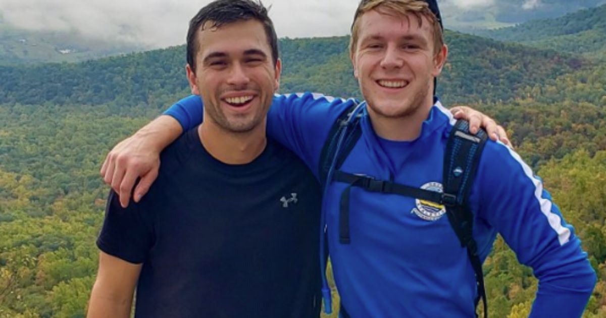 Phillip Todd, left, and Christopher Barnard, right, stop to take a photograph during a hike in 2020.