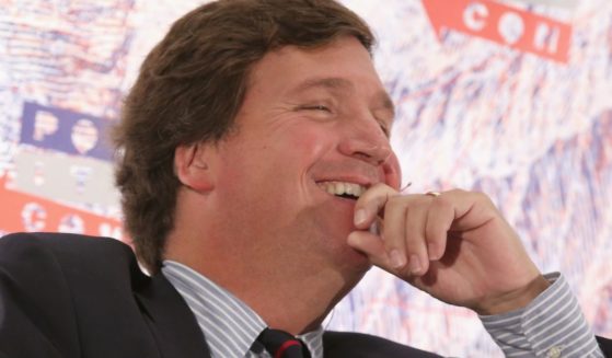 Tucker Carlson speaks onstage during Politicon at the Los Angeles Convention Center in Los Angeles on Oct. 21, 2018.