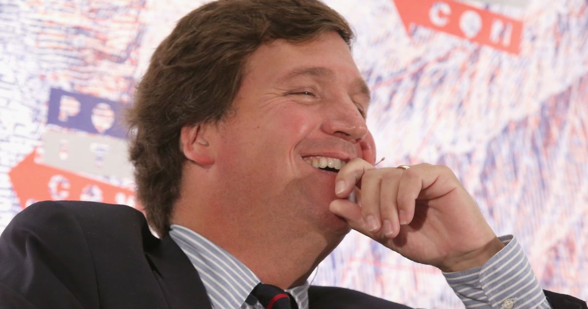 Tucker Carlson speaks onstage during Politicon at the Los Angeles Convention Center in Los Angeles on Oct. 21, 2018.