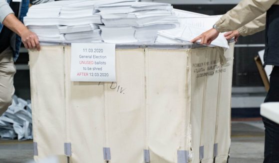 Gwinnett county workers begin their recount of the ballots on Nov. 13, 2020, in Lawrenceville, Georgia.