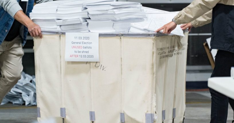 Gwinnett county workers begin their recount of the ballots on Nov. 13, 2020, in Lawrenceville, Georgia.