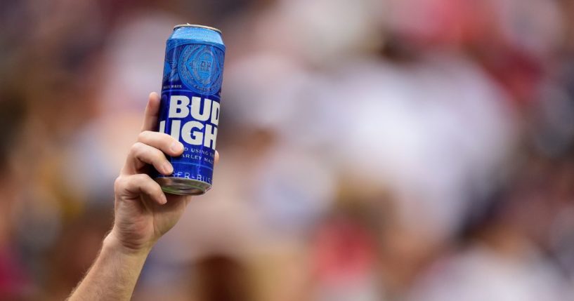 A fan holds up a can of Bud Light during a game between the New England Patriots and Washington Redskins at FedExField on Oct. 6, 2019, in Landover, Maryland.