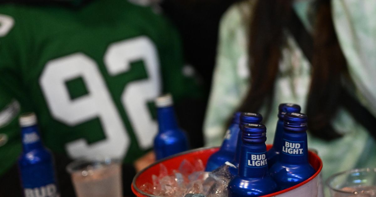 Philadelphia Eagles fans drink Bud Light while watching Super Bowl LVII at City Tap House on February 12, 2023 in Philadelphia.