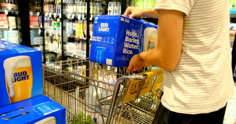 A shopper picks up a 36-can pack of Bud Light in a file photo from 2019.