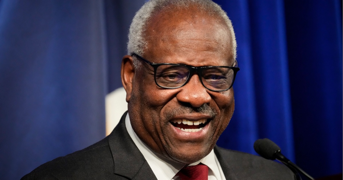 Supreme Court Justice Clarence Thomas smiled in a file photo from an October 2021 address to the conservative Federalist Society in Washington.