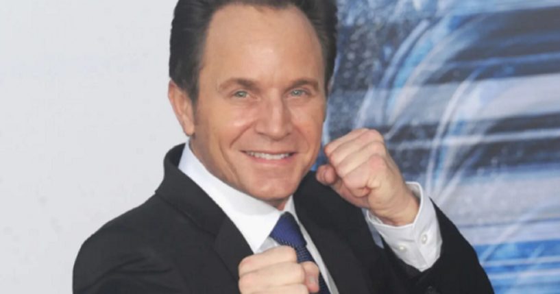 Actor David Yost strikes a Power Ranger pose at the premier of the movie "Power Rangers" on March 22, 2017.
