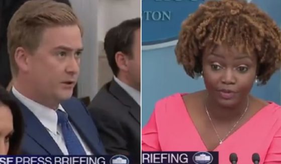 Fox News White House correspondent Peter Doocy, left, questions White House press secretary Karine Jean-Pierre, right.