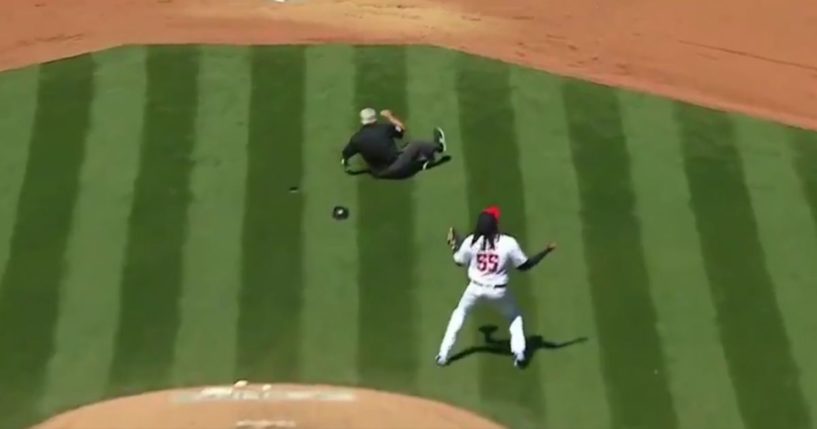 Larry Vanover lying on the ground after being hit in the head with a ball