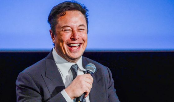 Twitter CEO Elon Musk laughs in a file photo from August 2022 at a meeting on the oil and energy business in Stavanger, Norway.
