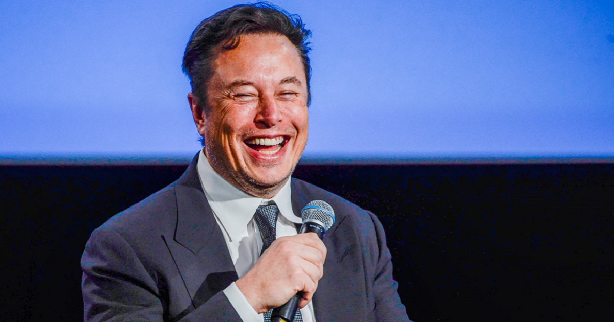 Twitter CEO Elon Musk laughs in a file photo from August 2022 at a meeting on the oil and energy business in Stavanger, Norway.