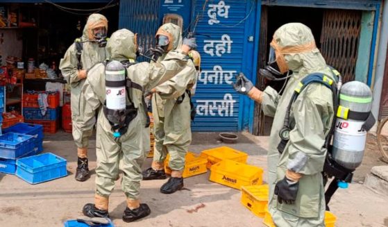 In this photo provided by India's National Disaster Response Force (NDRF) shows NDRF personnel engaged in evacuating people following a gas leak in Giaspura, Ludhiana, Punjab, India, on Sunday.