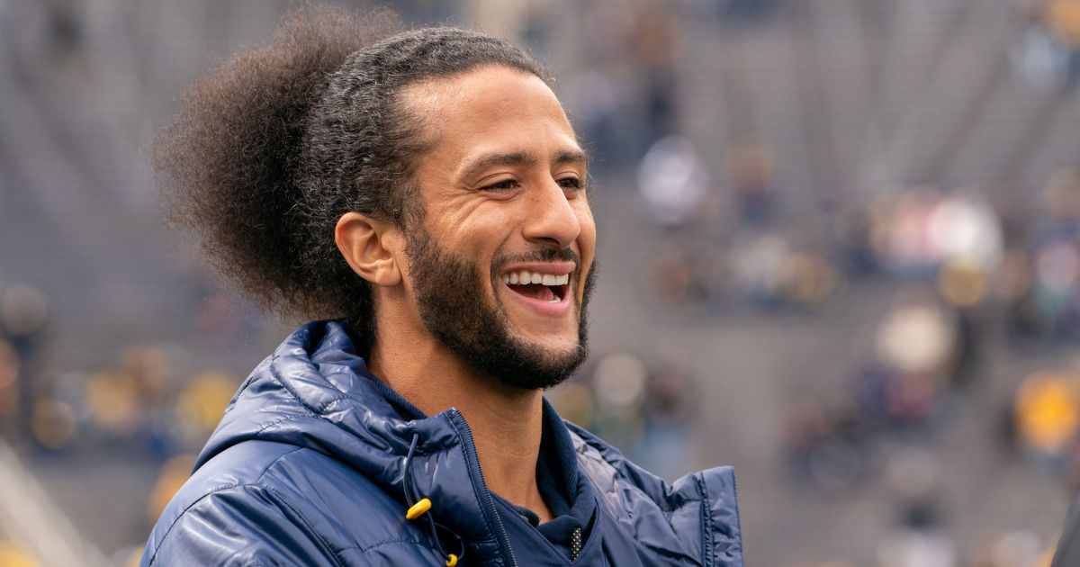 Colin Kaepernick interacts with fans before the Michigan spring football game at Michigan Stadium on April 2, 2022, in Ann Arbor, Michigan.