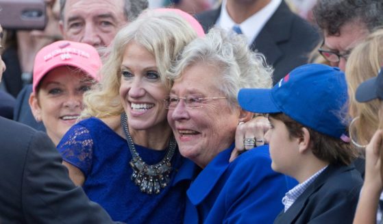 Donald Trump's former campaign manager Kellyanne Conway, left, poses for photos with Alabama Governor Kay Ivey during a thank you rally in Ladd-Peebles Stadium on December 17, 2016 in Mobile, Alabama.