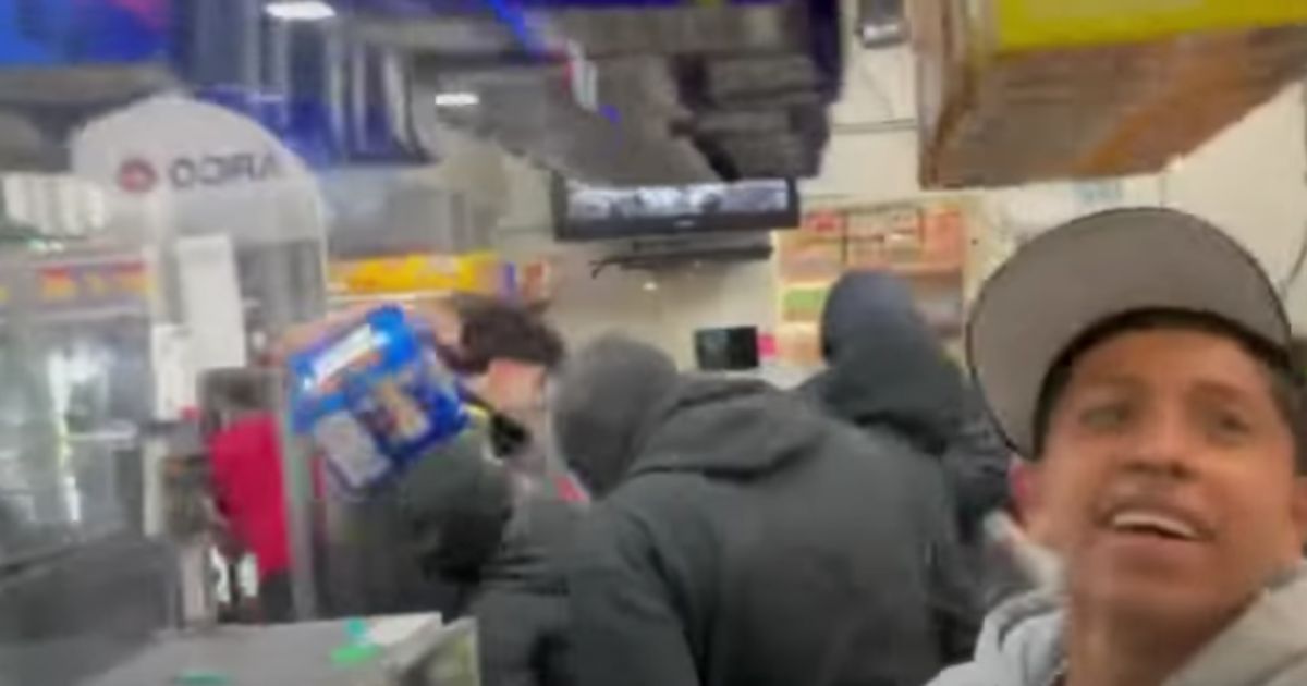 People are seen looting in a convenience store in California.