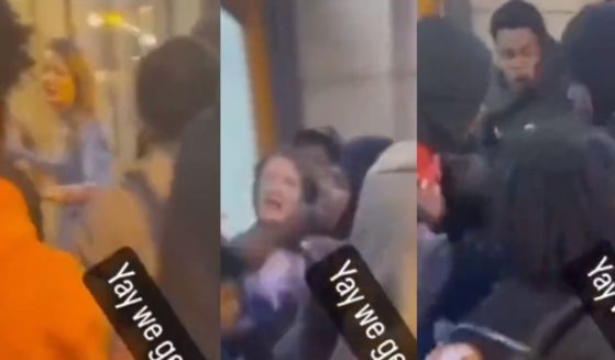 The above stills are from a viral video where a female appears to become engulfed in a mob.