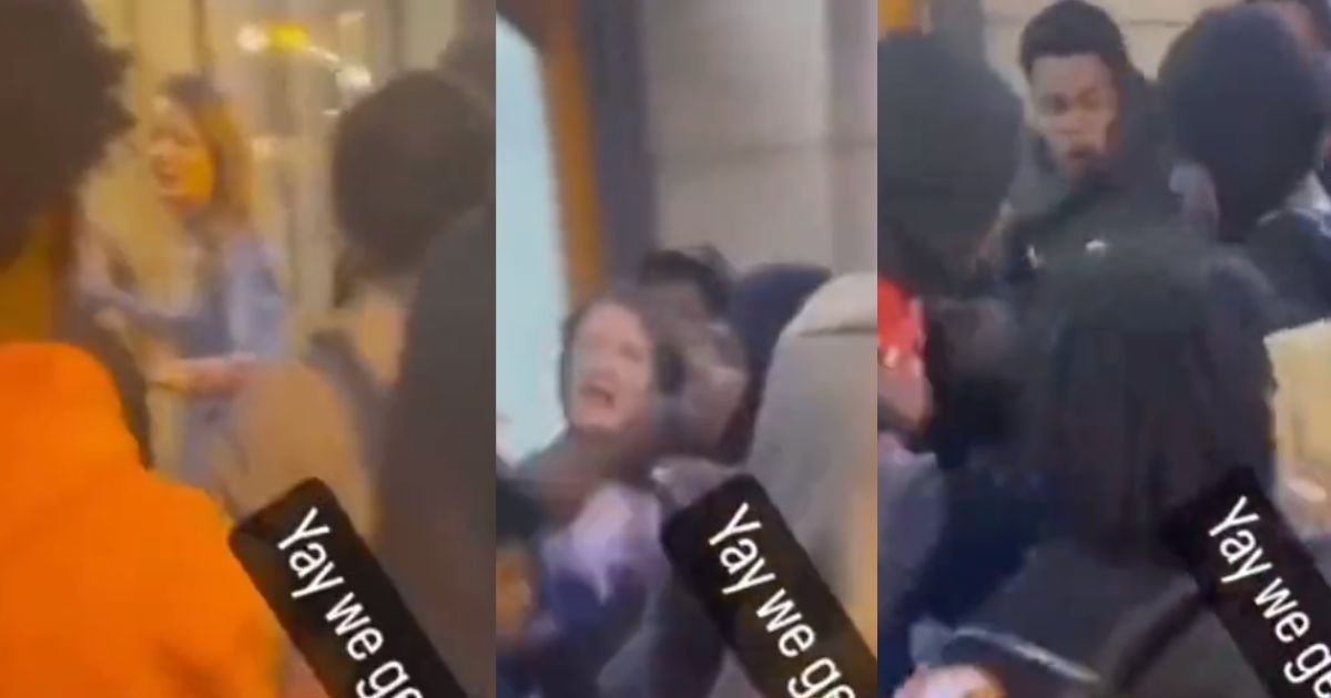The above stills are from a viral video where a female appears to become engulfed in a mob.