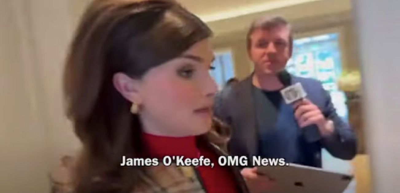 Transgender activist Dylan Mulvaney, foreground, is approached by conservative activist Jame's O'Keefe.