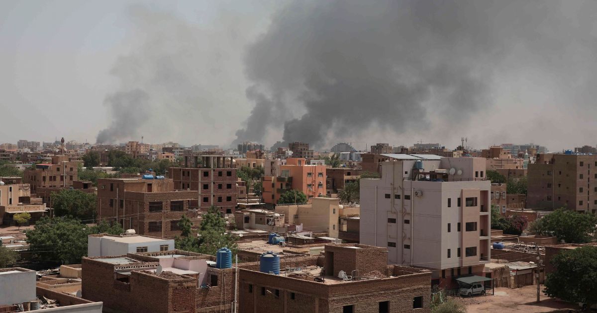 Smoke rises from a central neighborhood of Khartoum, Sudan