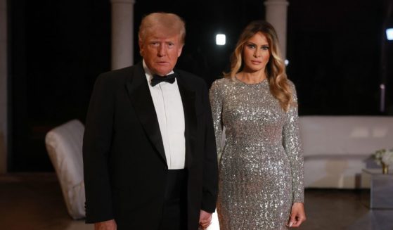 Former President Donald Trump and former first lady Melania Trump arrive for a New Year's event at his Mar-a-Lago home on Dec. 31, 2022, in Palm Beach, Florida.
