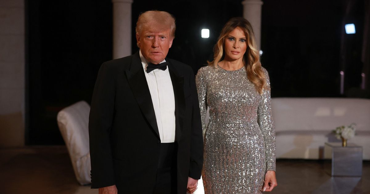 Former President Donald Trump and former first lady Melania Trump arrive for a New Year's event at his Mar-a-Lago home on Dec. 31, 2022, in Palm Beach, Florida.