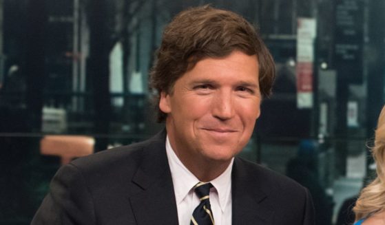 Tucker Carlson is onstage during "Fox & Friends" at FOX Studios on April 2, 2015, in New York City.