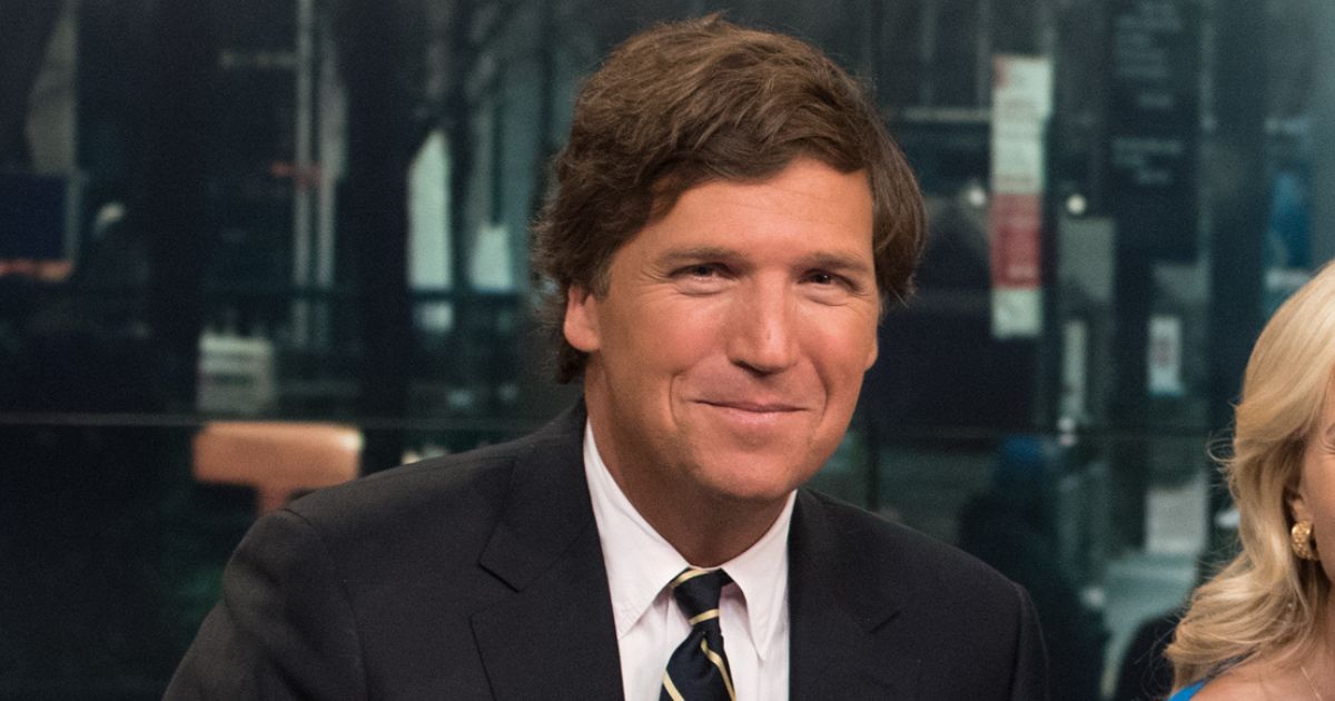Tucker Carlson is onstage during "Fox & Friends" at FOX Studios on April 2, 2015, in New York City.