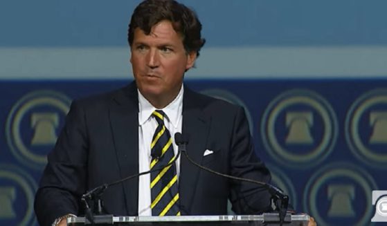 Now-former Fox News host Tucker Carlson delivers a speech Friday at The Heritage Foundation's 50th anniversary celebration outside Washington, D.C.