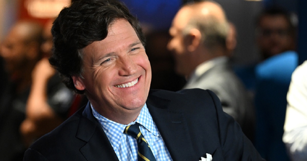 Now-former Fox News host Tucker Carlson is pictured laughing in a file photo from the 2022 FOX Nation Patriot Awards at Hard Rock Live at Seminole Hard Rock Hotel & Casino Hollywood on Nov. 17 in Hollywood, Florida.