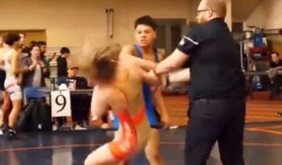 Police in Illinois are investigating after a teenage wrestler sucker-punched his opponent after he lost a match on April 8.