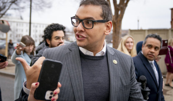 Republican Rep. George Santos of New York is seen in a file photo from January leaving a House GOP conference meeting on Capitol Hill in Washington. A federal indictment unsealed Wednesday charged Santos with seven counts of wire fraud, three counts of money laundering, one count of theft of public funds and two counts of making materially false statements to the House of Representatives.