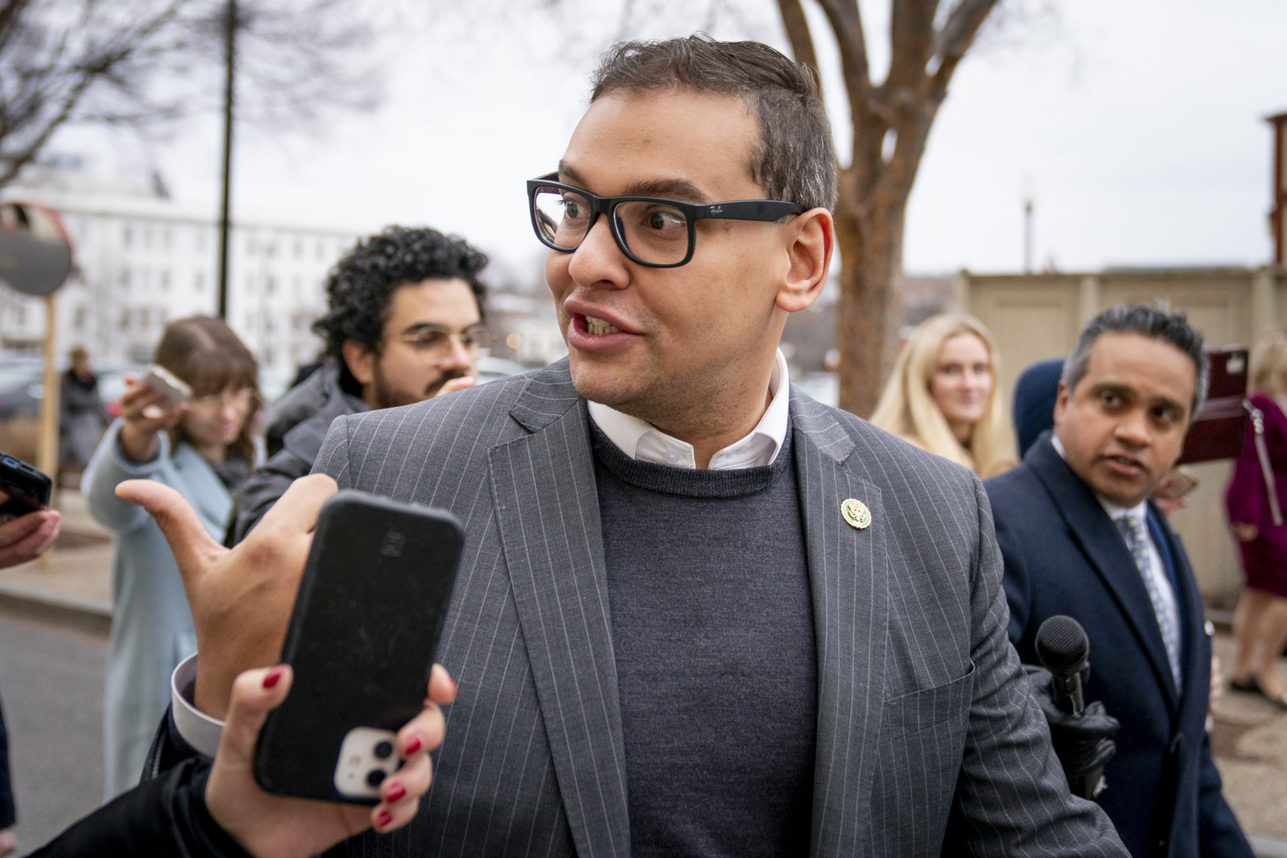 Republican Rep. George Santos of New York is seen in a file photo from January leaving a House GOP conference meeting on Capitol Hill in Washington. A federal indictment unsealed Wednesday charged Santos with seven counts of wire fraud, three counts of money laundering, one count of theft of public funds and two counts of making materially false statements to the House of Representatives.