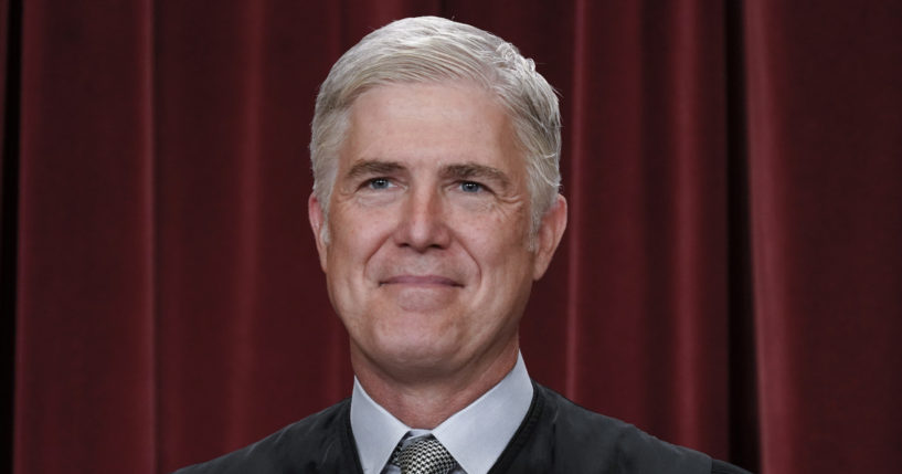 Justice Neil Gorsuch poses for a portrait at the Supreme Court building in Washington on Oct. 7, 2022.