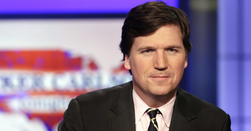 Tucker Carlson poses for photos at the Fox News Channel studio in New York on March 2, 2017.