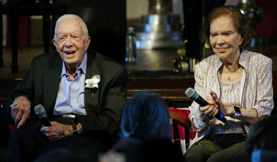Former President Jimmy Carter and his wife, Rosalynn Carter, sit together during a reception to celebrate their 75th wedding anniversary in Plains, Georgia, on July 10, 2021.