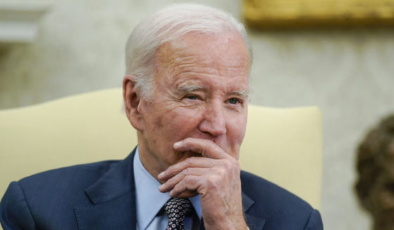 Joe Biden listening in a meeting