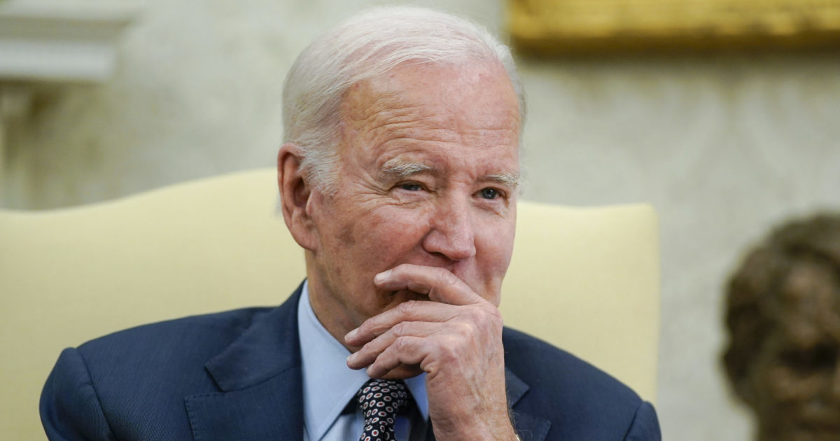 Joe Biden listening in a meeting